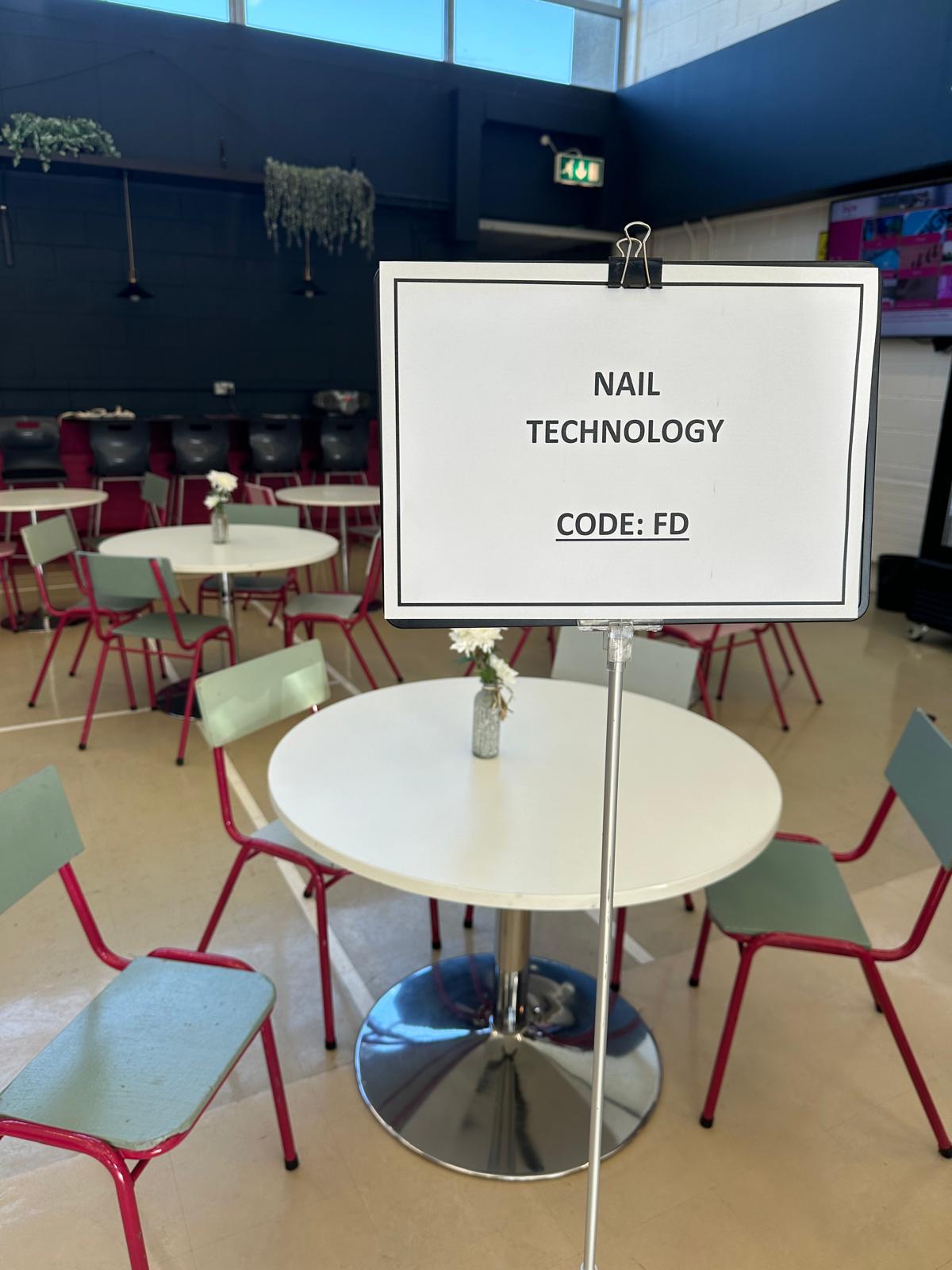 Nail Technician and StudioAdministration Nail technician managing salon administration tasks in a professional beauty salon environment.